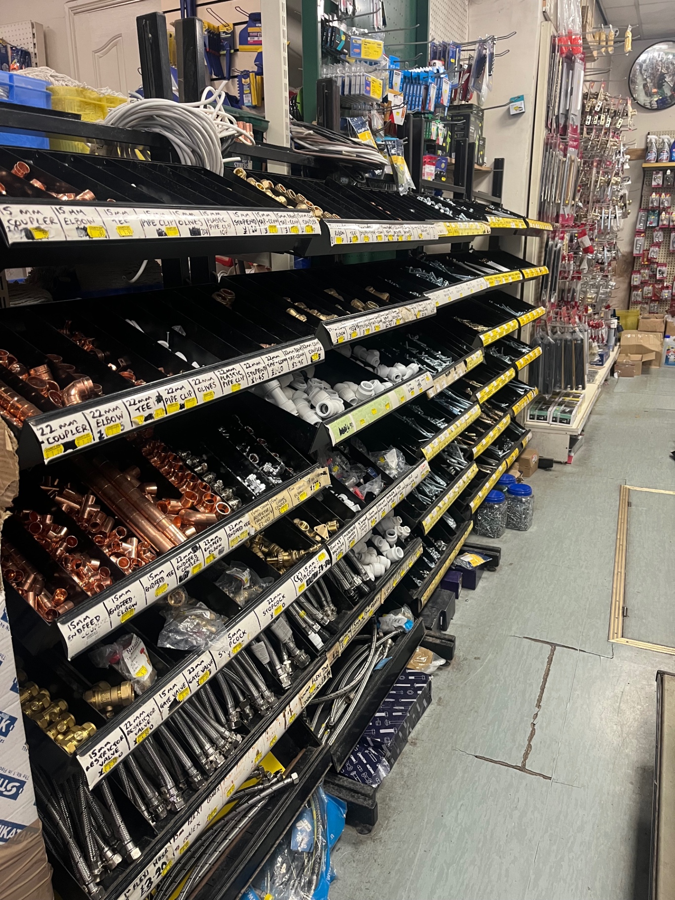 County DIY plumbing aisle with copper fittings, hoses and fixings